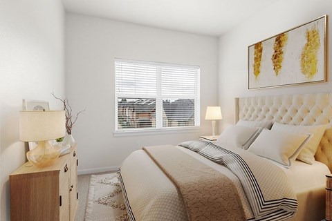 A bedroom with a large bed, a nightstand with a lamp, and a painting on the wall.