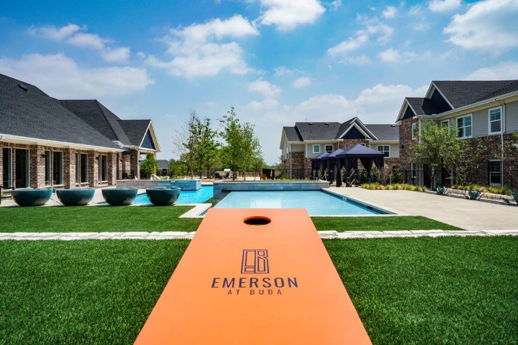 A view of a swimming pool and a sign that says Emerson.
