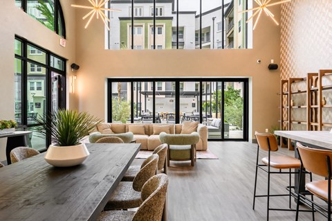 A modern dining area with a long table and chairs.