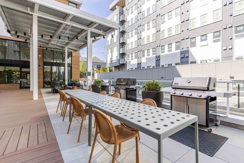A patio with a table and chairs is set up.