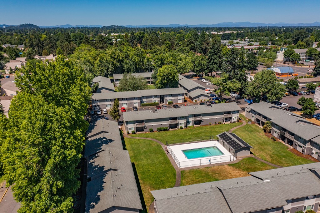arial view of the buildings and a pool