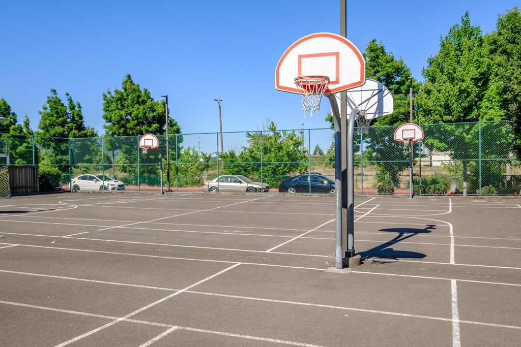 a basketball hoop in a parking lot