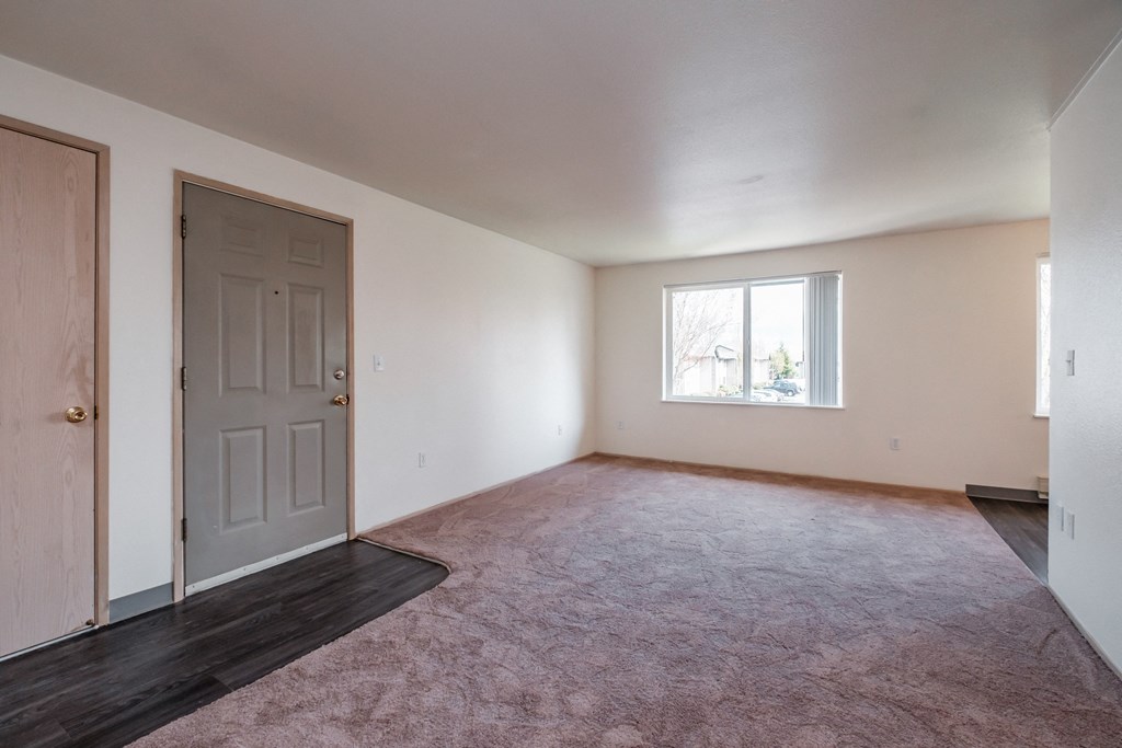 a bedroom with a door and a window