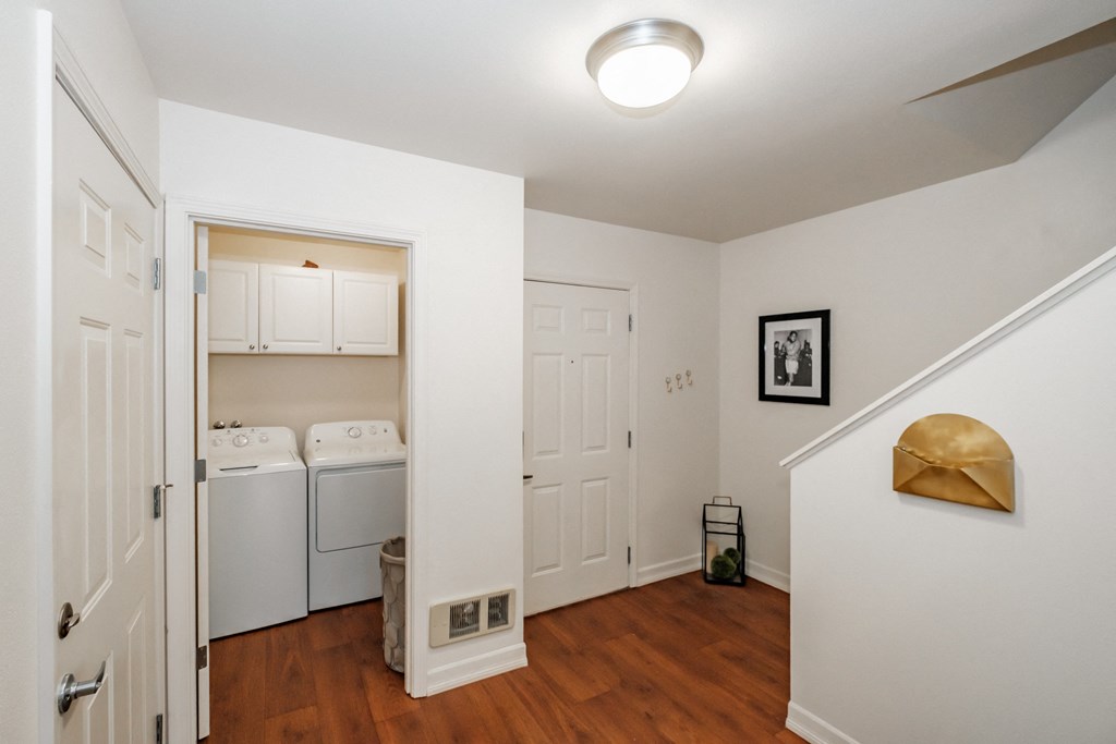 a small laundry room with a washer and dryer