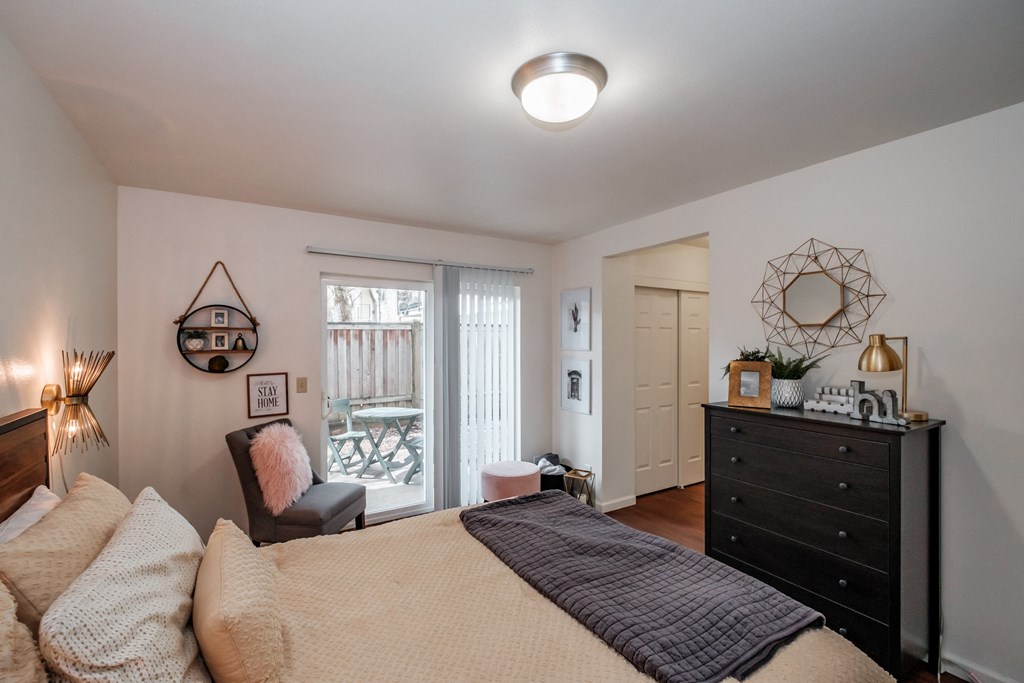 a bedroom with a bed and a dresser