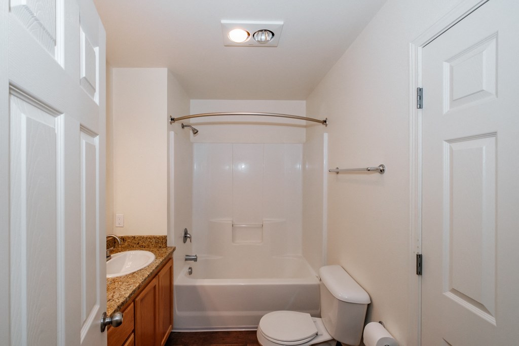 a bathroom with a toilet sink and bathtub