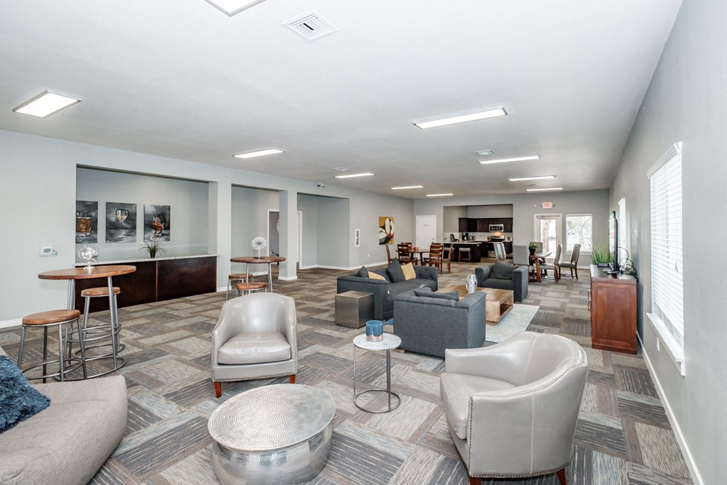a common area with couches chairs and tables