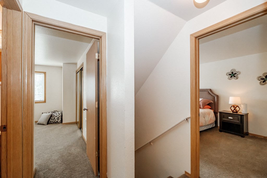 a view of the bedroom from the hallway