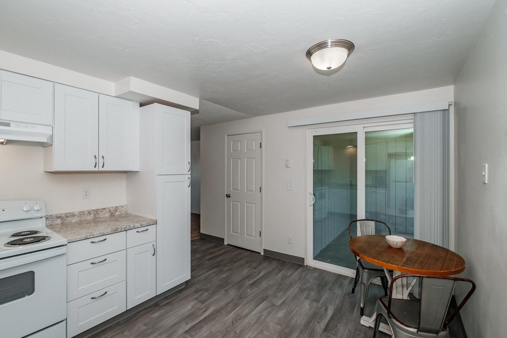 a kitchen and dining area in a 555 waverly unit