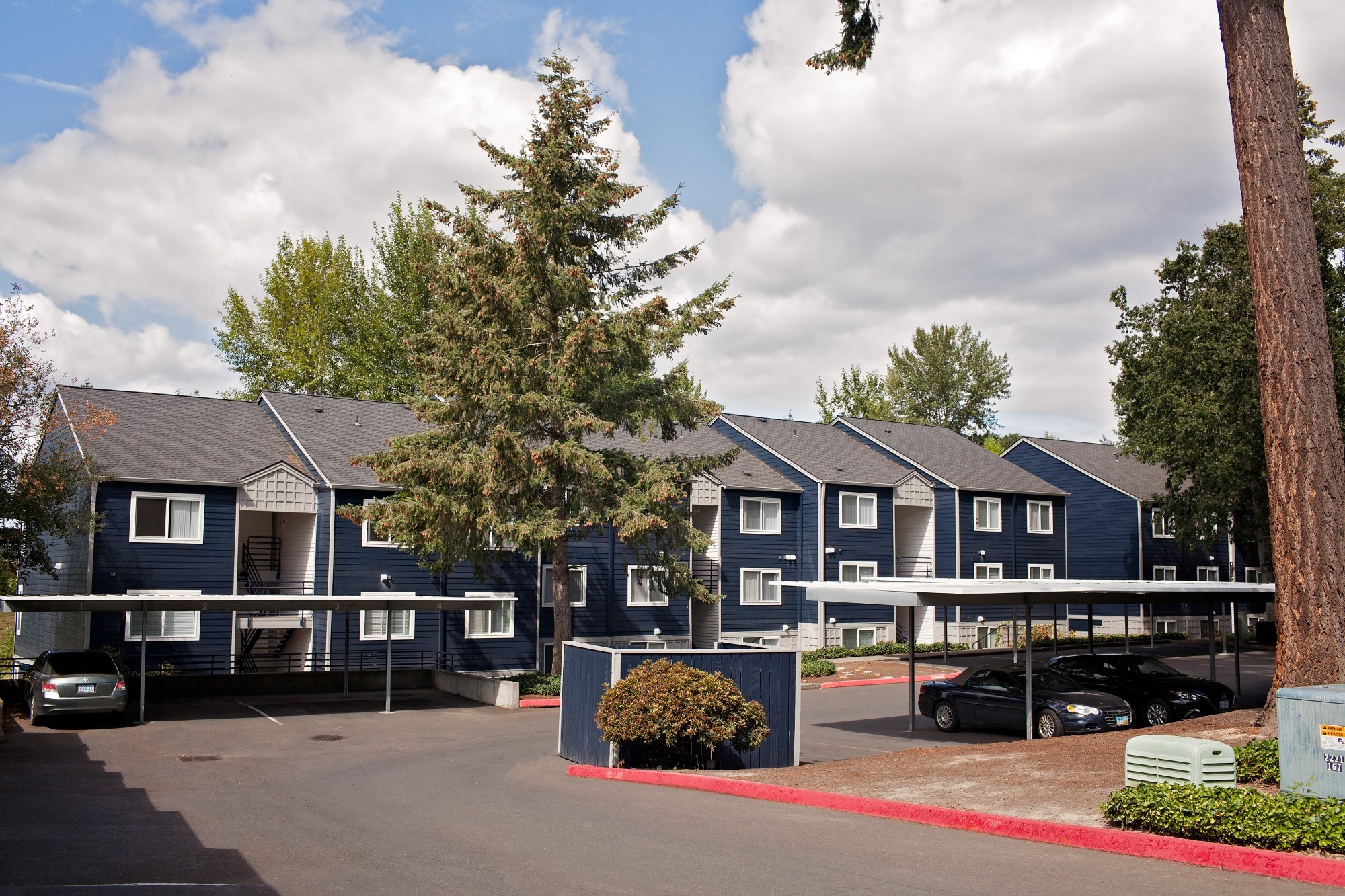 Clermont Exterior View of Apartments and Covered Parking Spaces