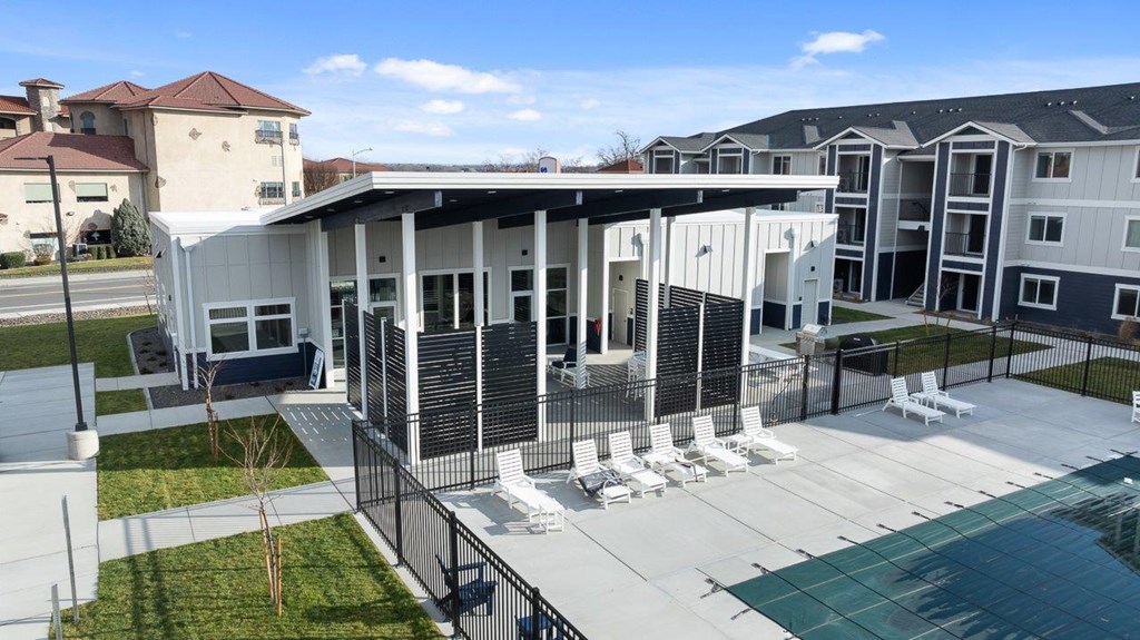 A modern building with a pool in front.