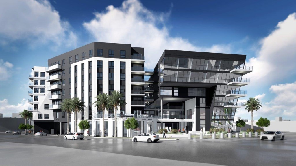 A modern building with a glass facade is depicted in the image.