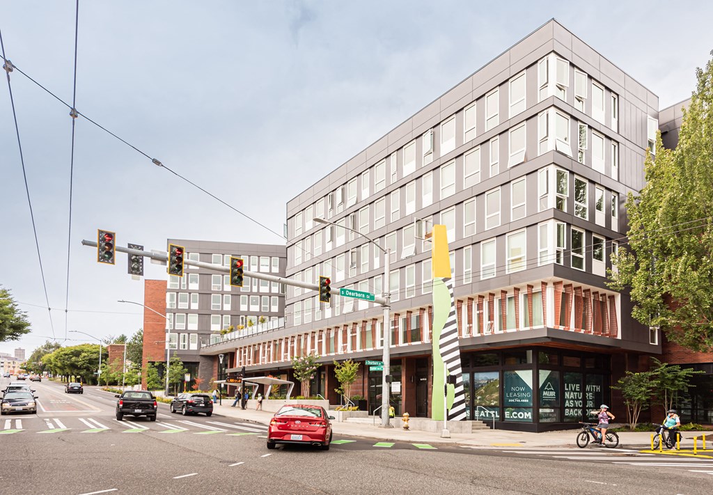 a large building on the corner of a busy city street