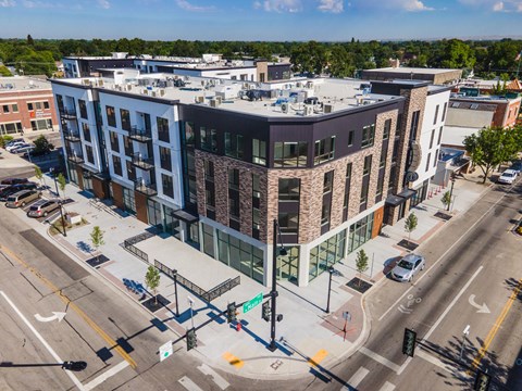 Modern mixeduse building exterior at street corner at Old Town Lofts Apartments, Meridian
