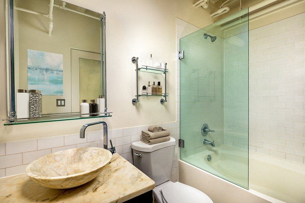 a bathroom with a shower and a sink