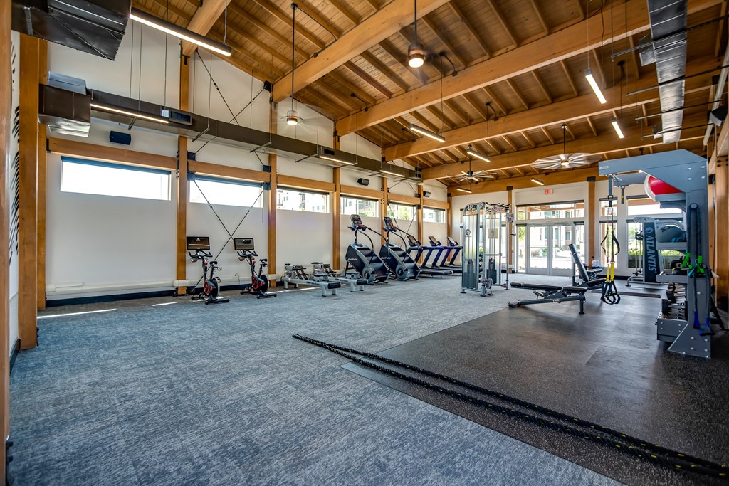 Discovery at the Realm Apartments large fitness center with cardio machines