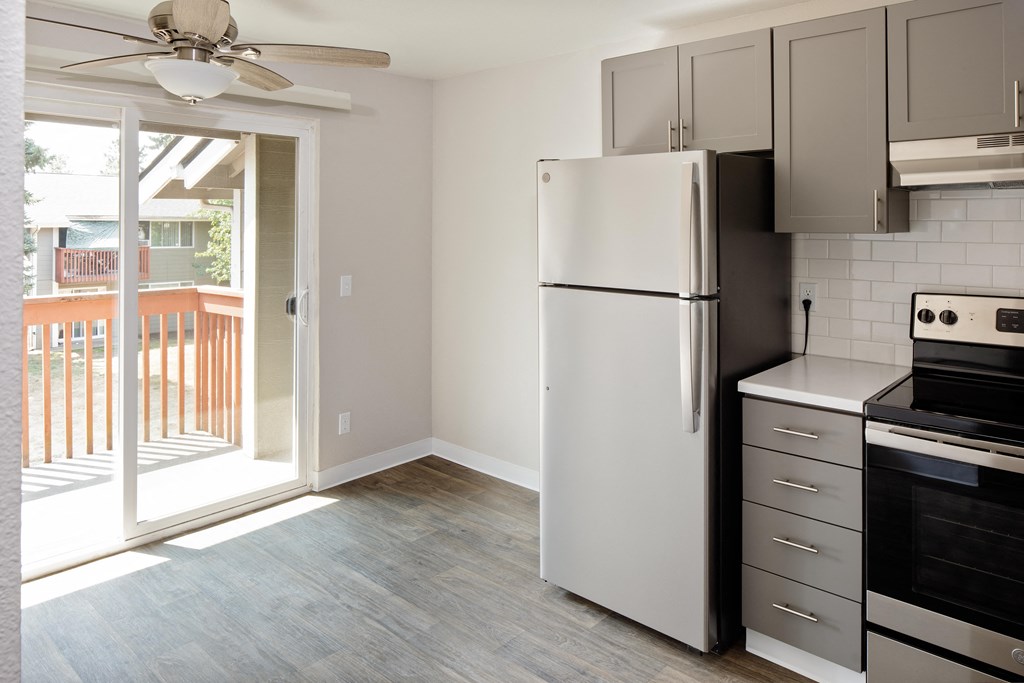 a kitchen and living room in a 555 waverly unit