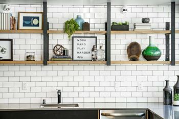 Chic Spaces with Handpainted Murals and Blackened Steel Accents