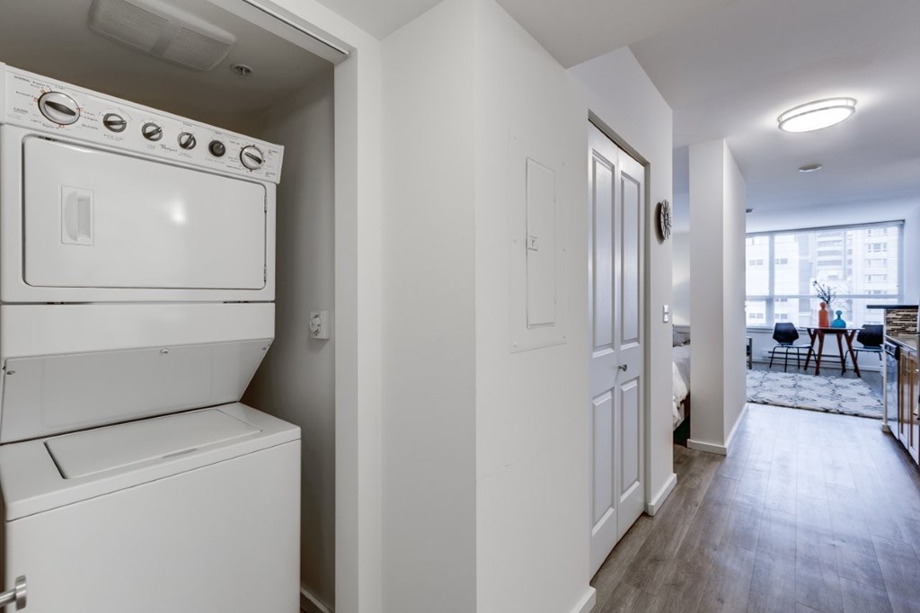 A white oven and dishwasher in a kitchen.