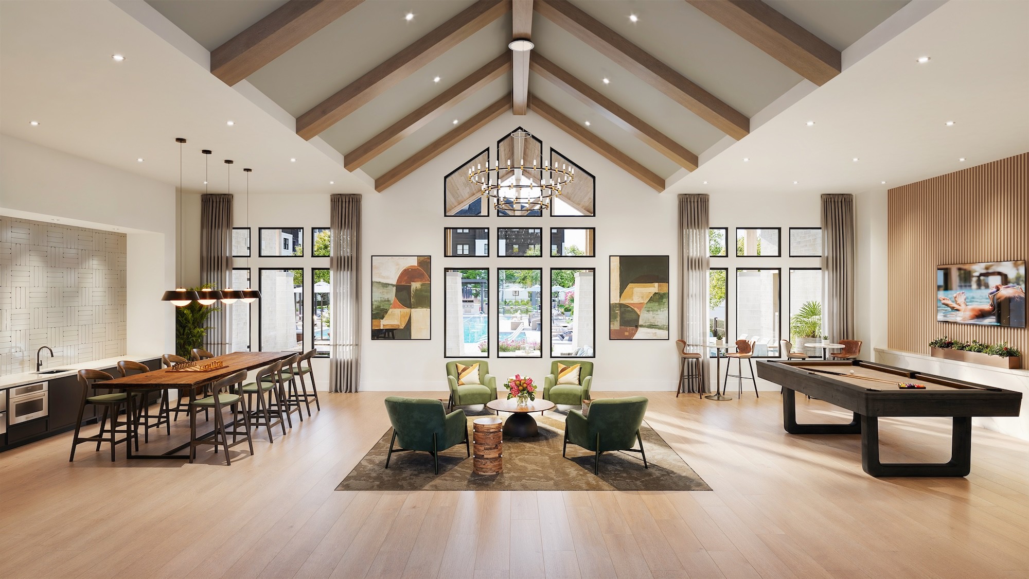 A large, well-lit room with a long table and chairs, a pool table, and a large window with curtains.