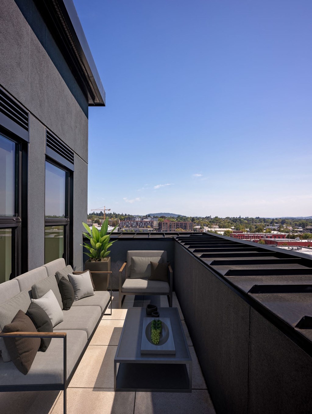 a balcony with a couch and a coffee table