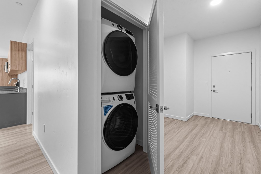 a washer and dryer in a laundry room with a door