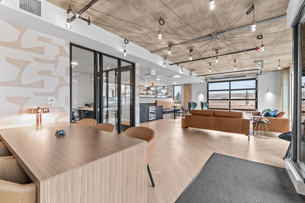 a living room and dining room with a table and chairs