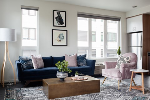 Grant Park Village living room shot of couches with kitchen