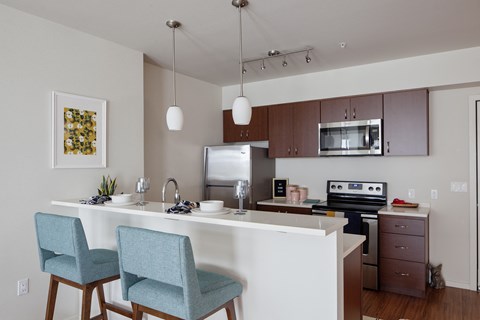 Grant Park Village kitchen shot with bar and blue bar stools