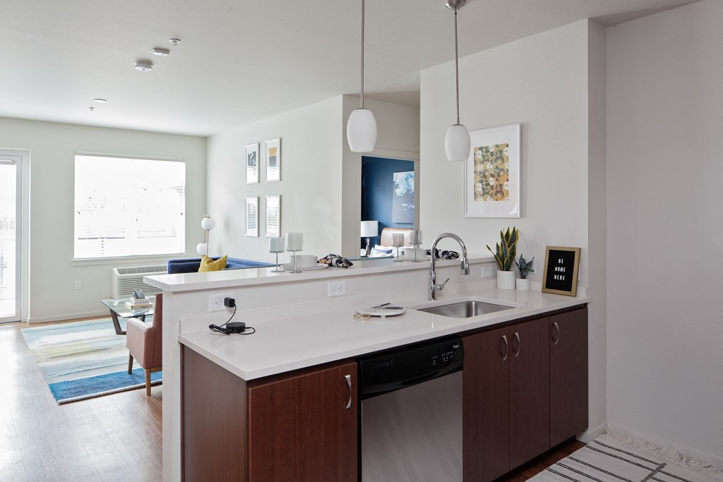 Grant Park Village kitchen island shot with living room in background