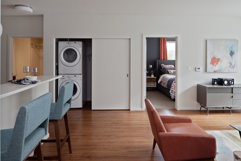 Grant park village kitchen bar and orange chair with washer and dryer in background