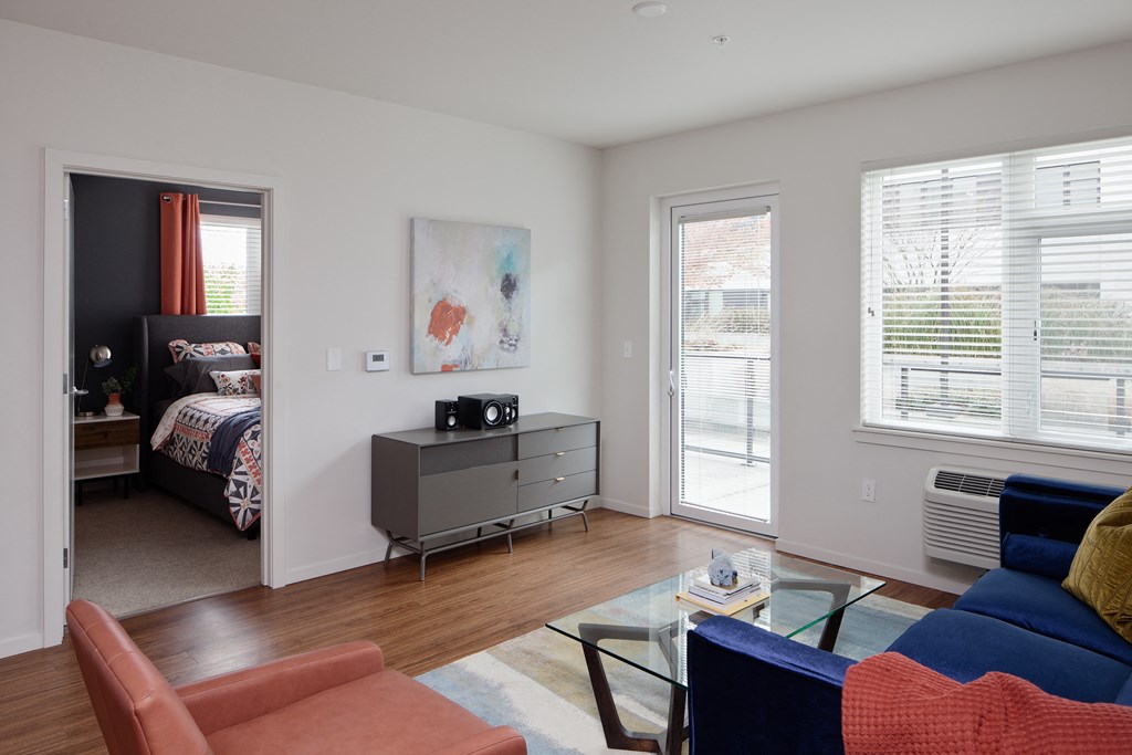 Grant park village living room shot of media stand and bedroom in background