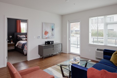 Grant park village living room shot of media stand and bedroom in background