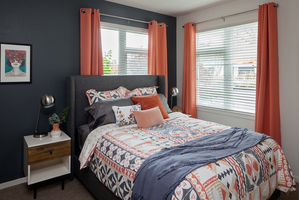 Grant park village shot of bed with  orange curtains