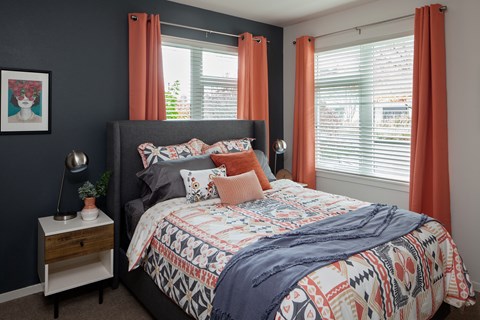 Grant park village shot of bed with  orange curtains