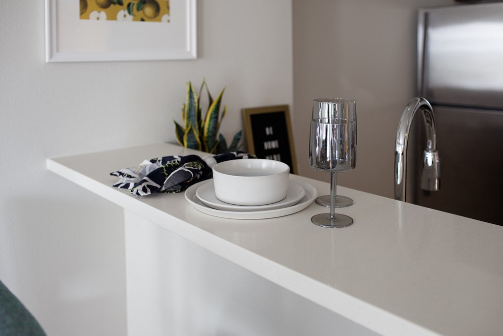 Grant park village shot of plates and wine glasses on kitchen bar