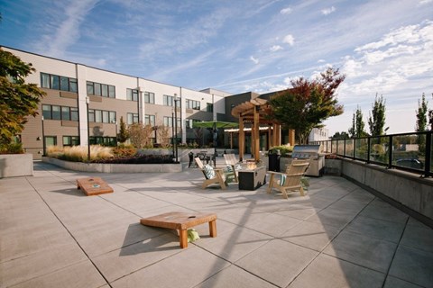 A sunny day at the outdoor seating area of a modern building.