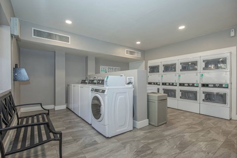 A laundry room with a washer and dryer in it.