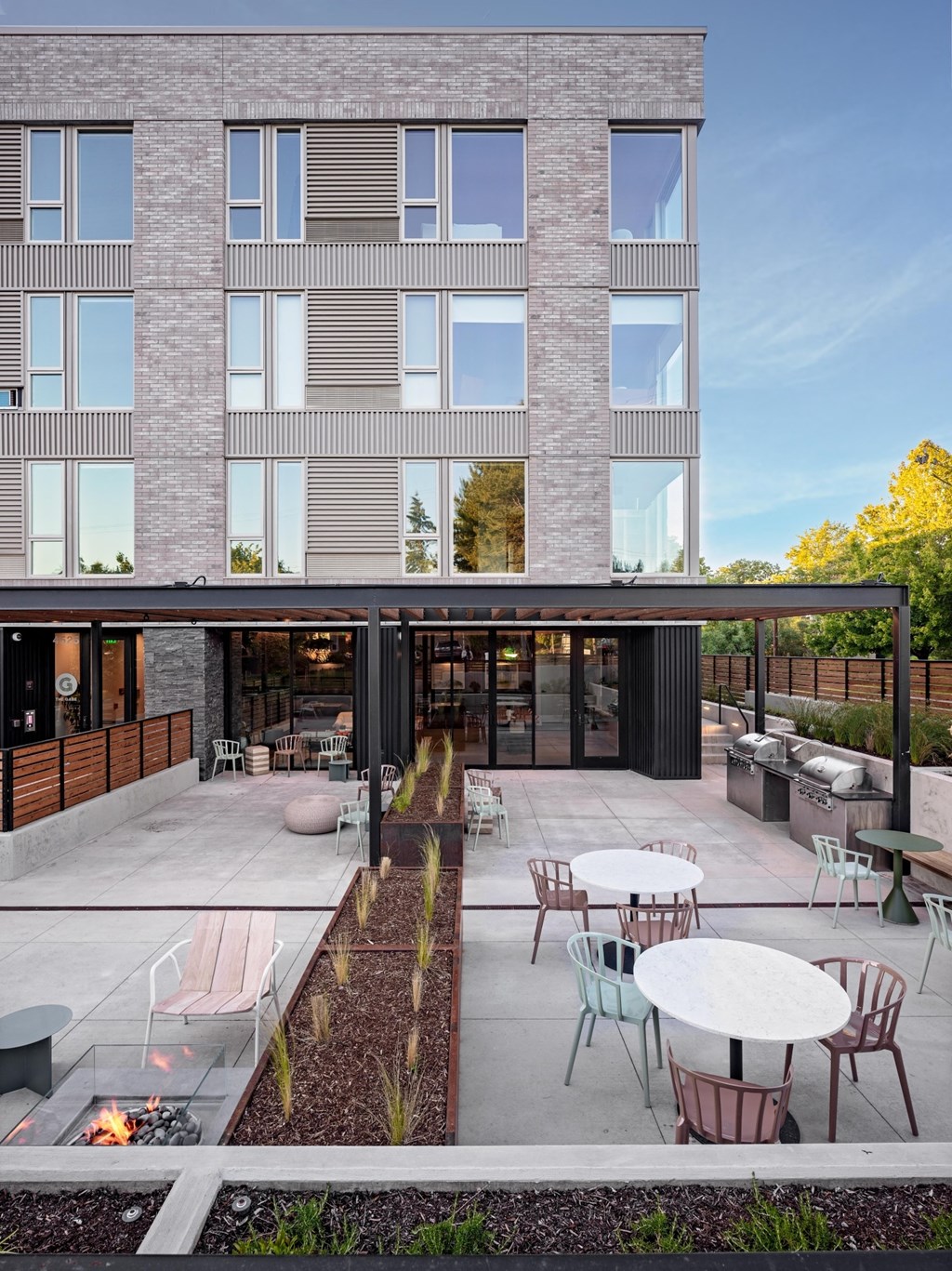 The Gabe Apartments in Portland, Oregon Patio with BBQ Grills and Fire Pit