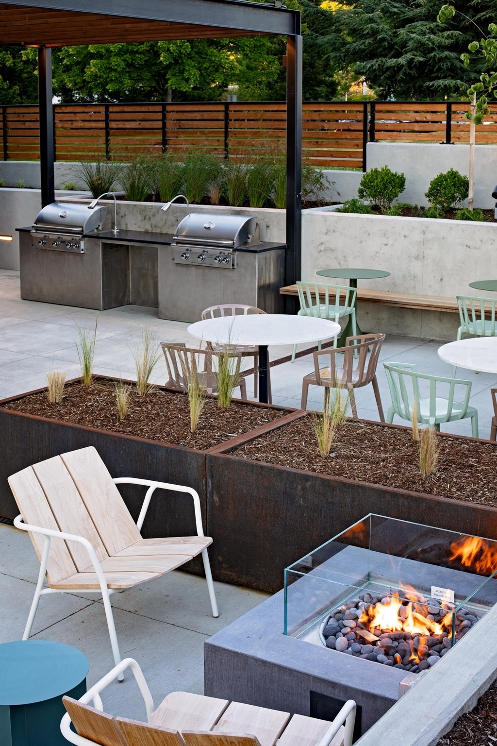 The Gabe Apartments in Portland, Oregon Patio with BBQ Grills and Fire Pit