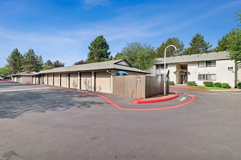 A parking lot with a red circle painted on the pavement.