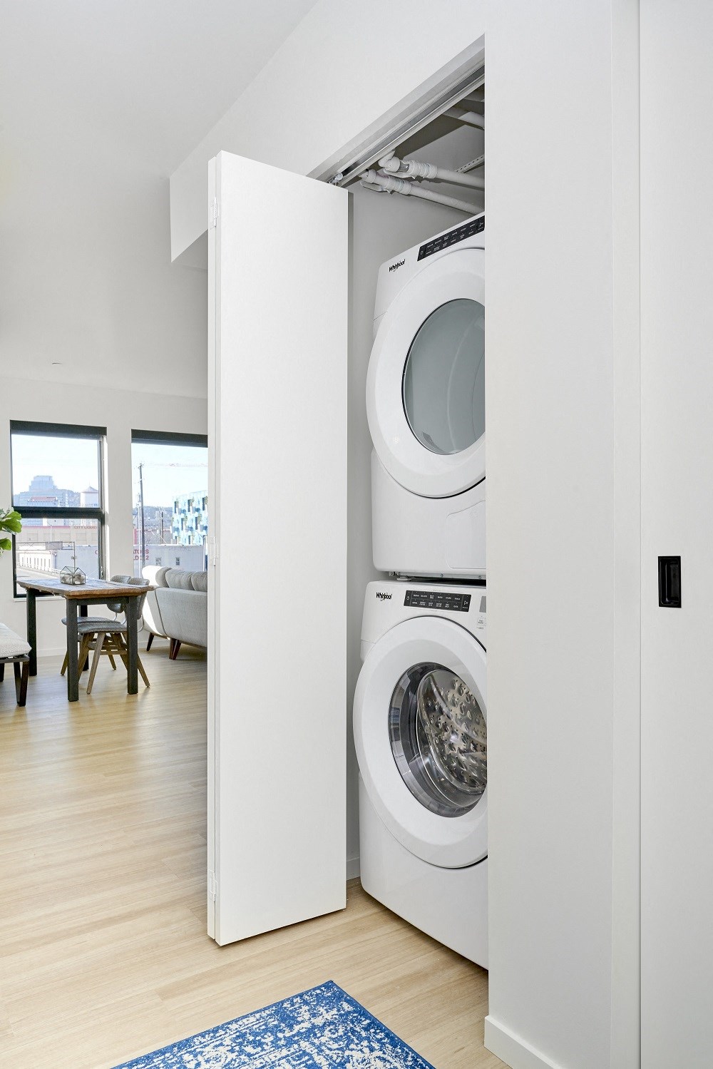 a washing machine and dryer in a white closet