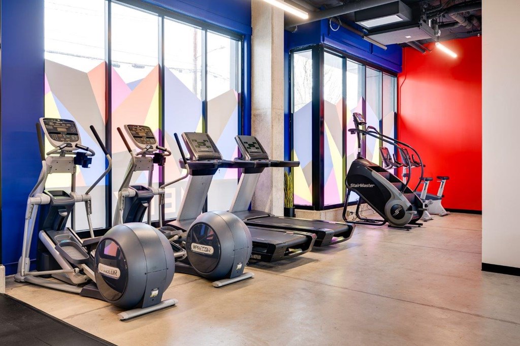 MERX Slabtown gym with a row of treadmills and exercise bikes.