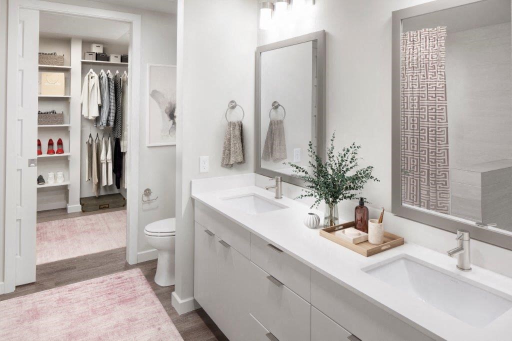 a white bathroom with a sink and a mirror