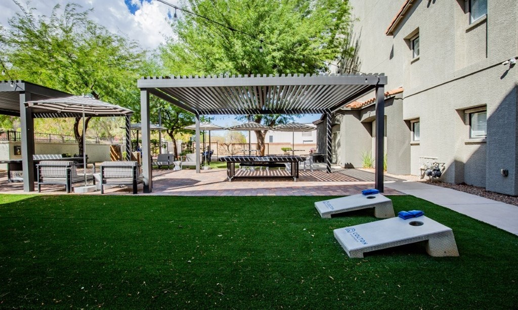 Colton Apartments A patio space with a pavilion and benches.