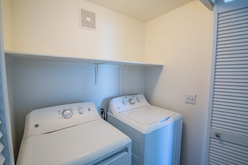 Colton Apartments laundry area with washer and dryer