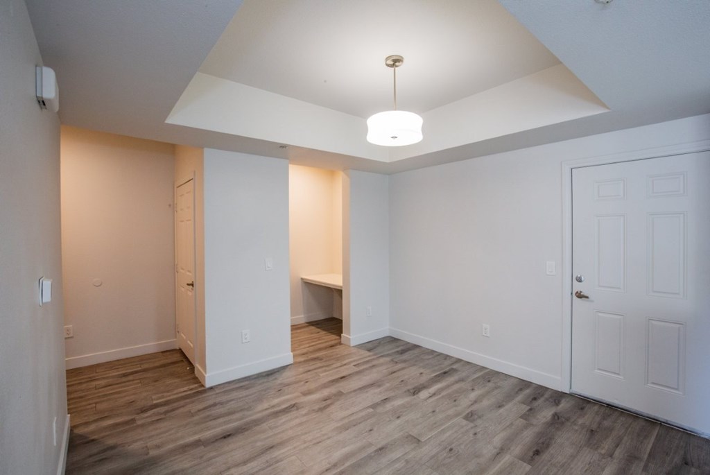 Colton Apartments   A room with a white door and a white ceiling light.
