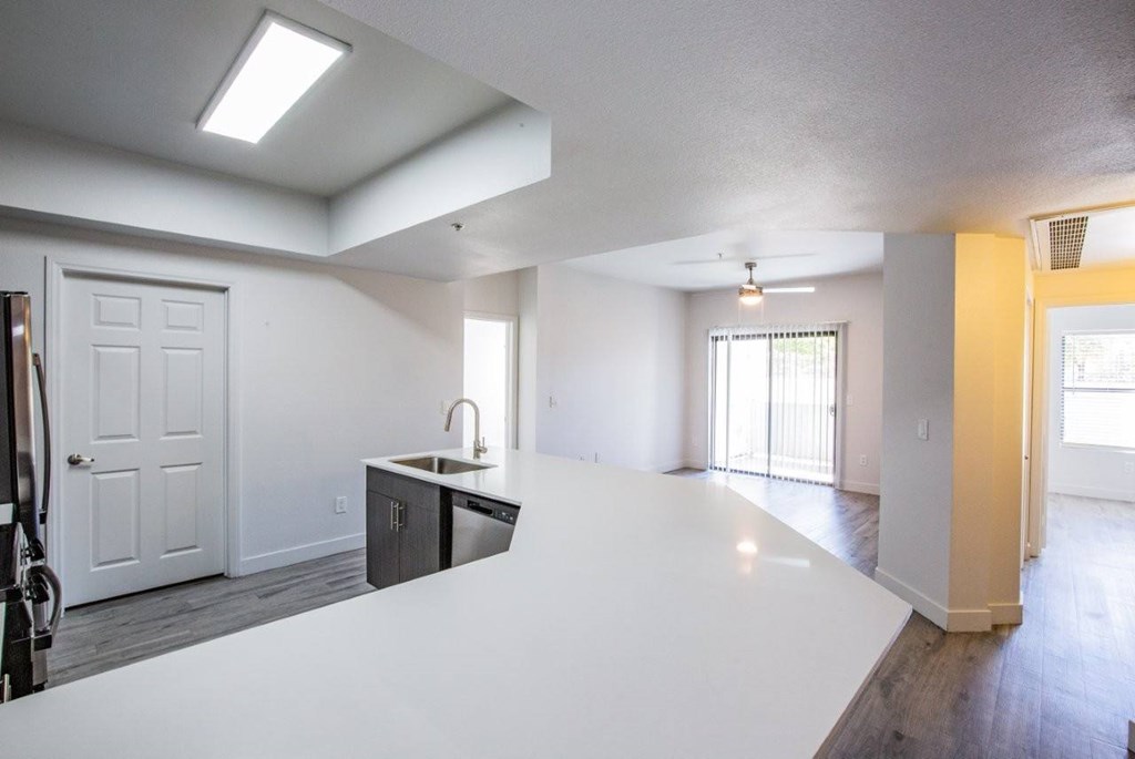 Colton Apartments kitchen with white countertops and skylight