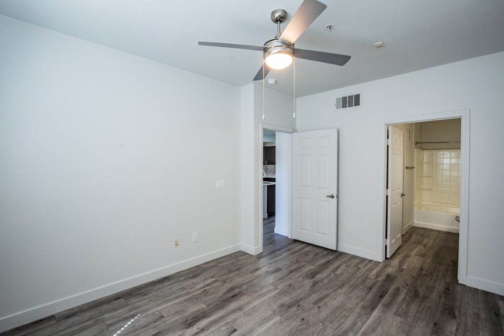 Colton Apartments   bedroom with wood floors and ceiling fan