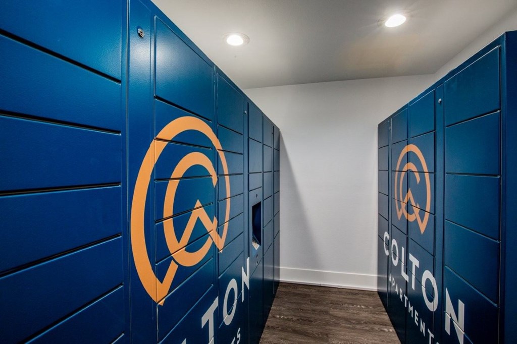 Colton Apartments A row of blue lockers with the Colton logo on them.